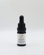 A small dark glass dropper bottle with a black cap and a white label, centered on a light gray background. The label reads 'ADISA MAY' and 'Replenish & Glow Antioxidant Oil Serum'.