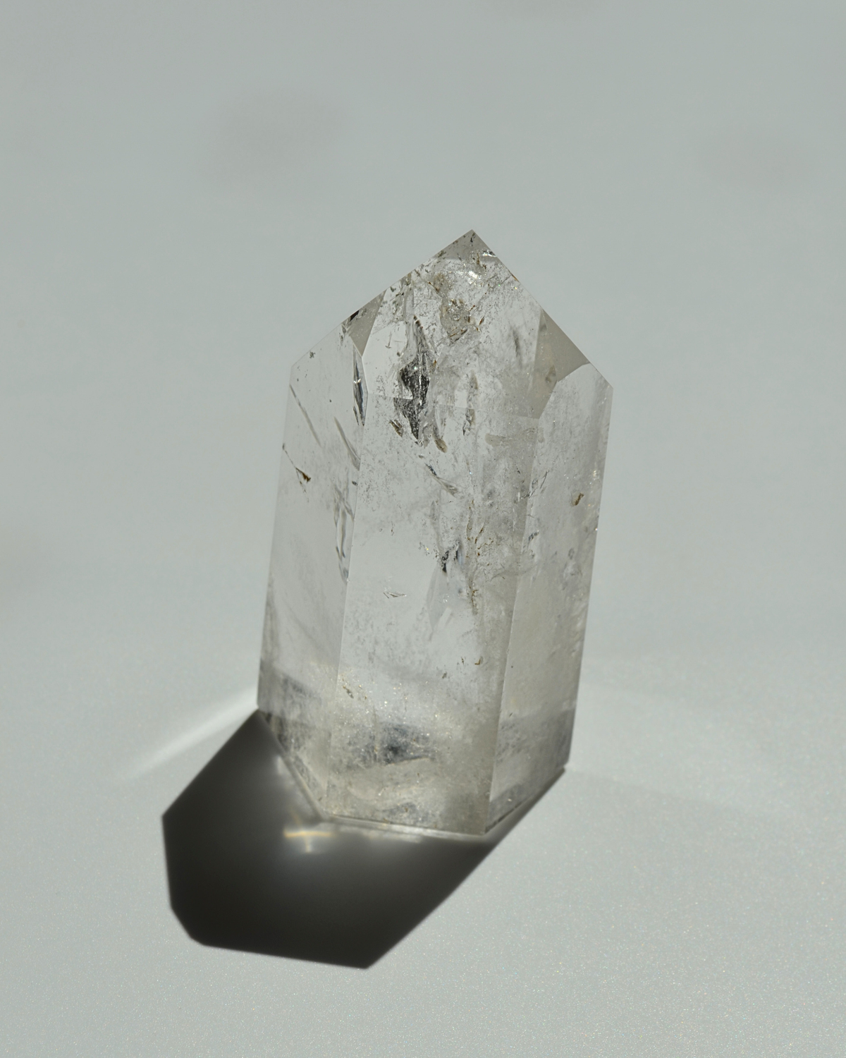 Clear crystal tower on a white background