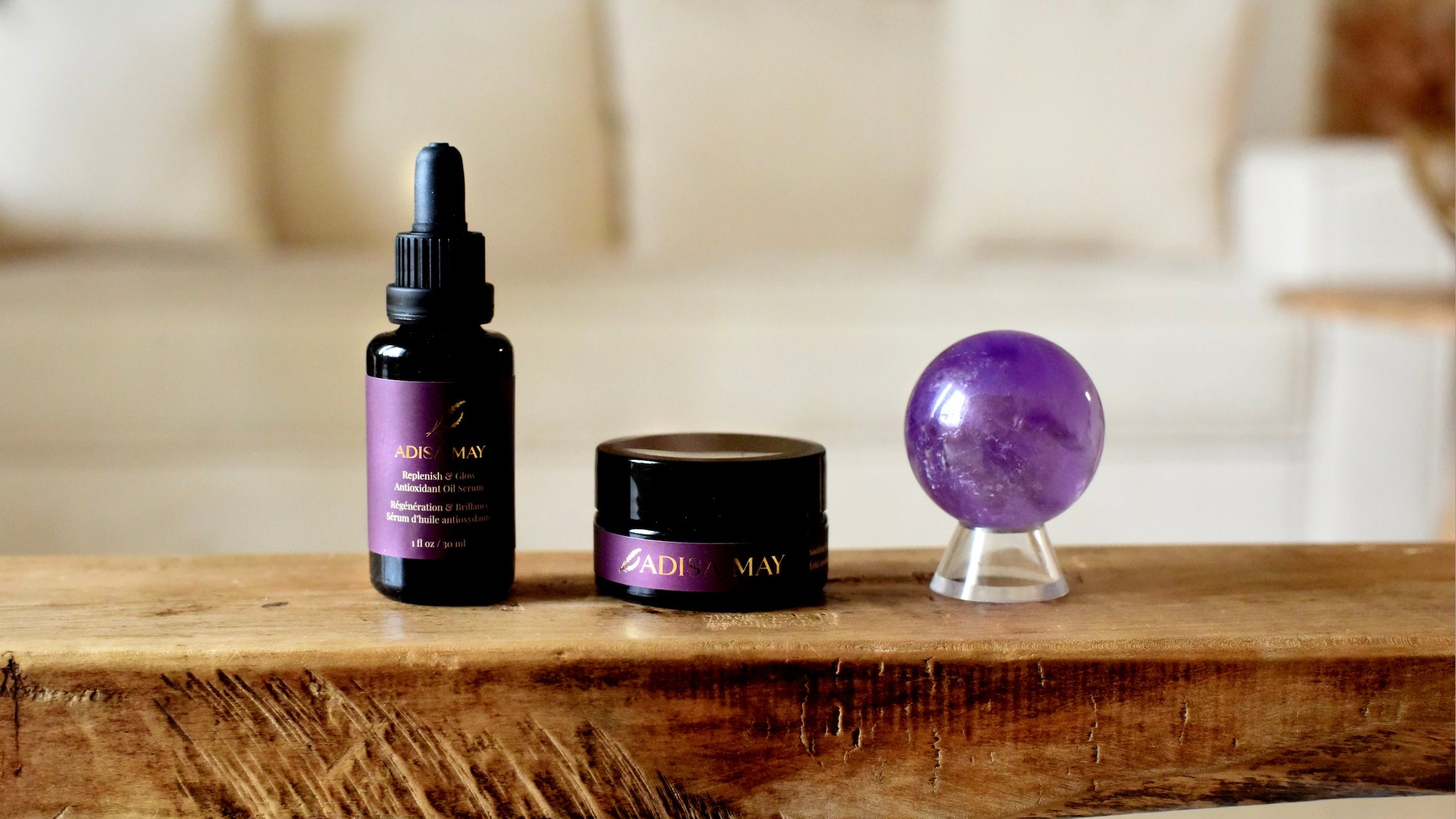 Three purple products on a wooden surface with a blurred background
