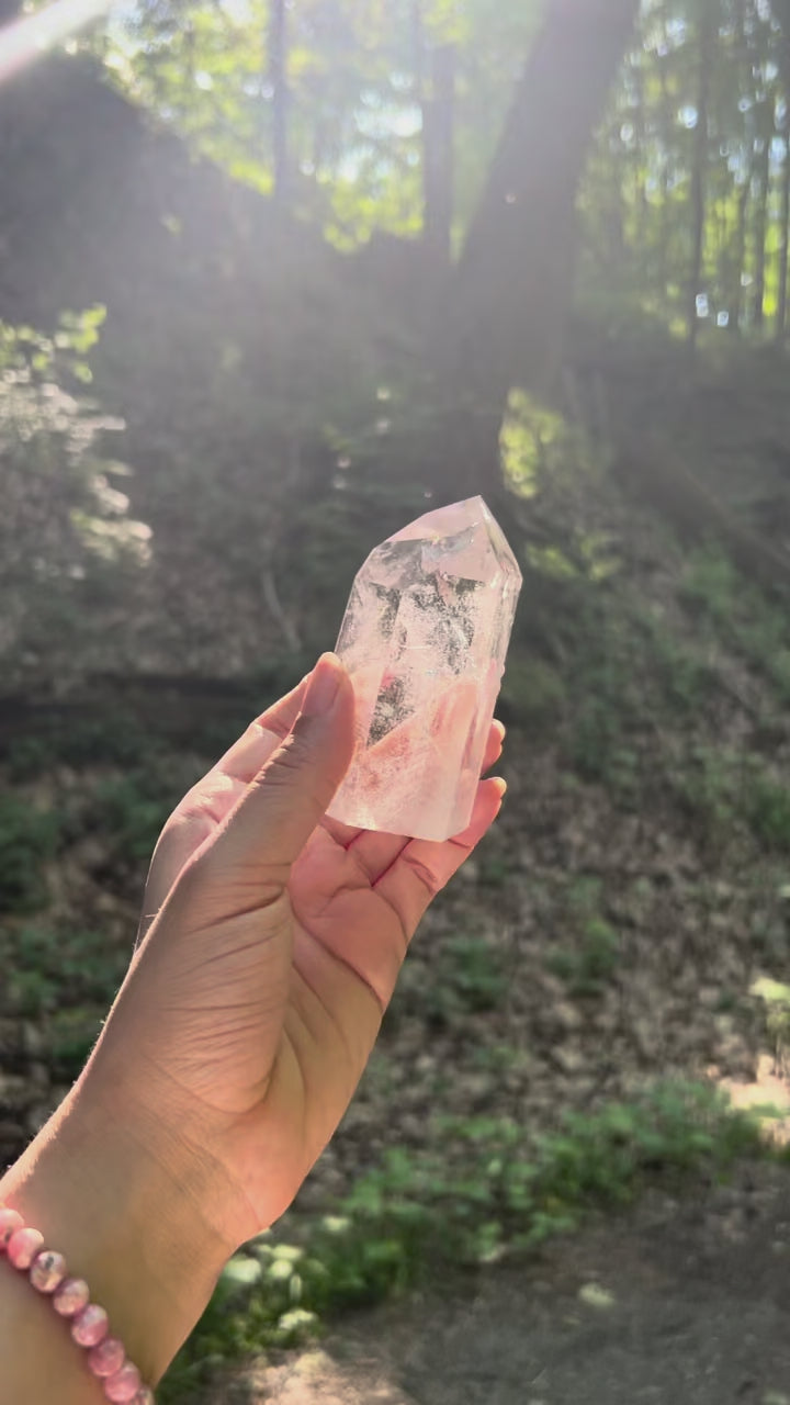 Video of a clear quartz crystal in a forest